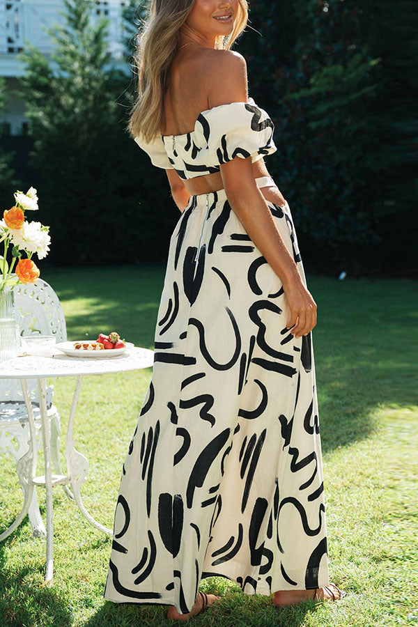 Deslumbra | Conjunto de top corto estampado con hombros descubiertos y falda maxi con bolsillos y aberturas